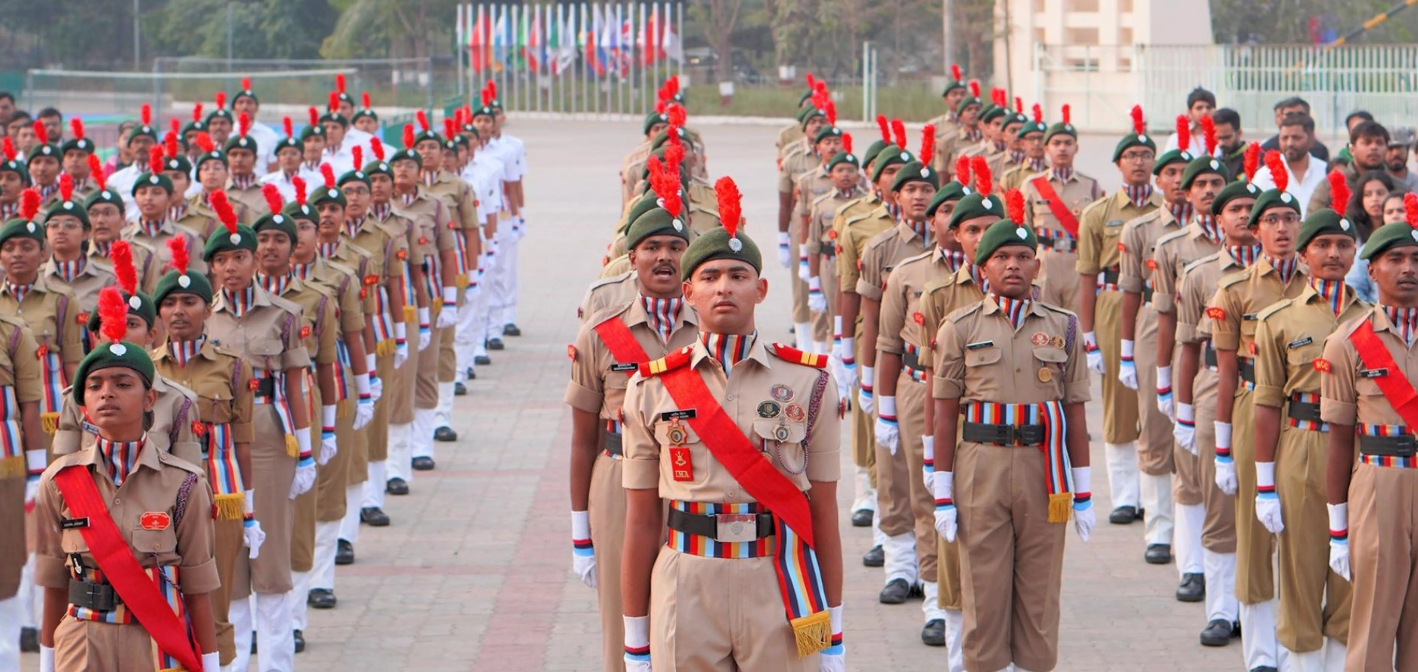 Students of Indus University participating in NCC cadet parade showcasing discipline, leadership, and training in Ahmedabad campus